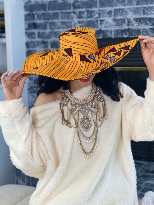 Woman wearing a large yellow hat.