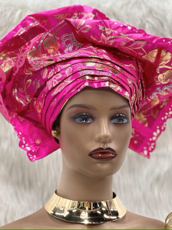 Pink and gold headwrap with a gold necklace.