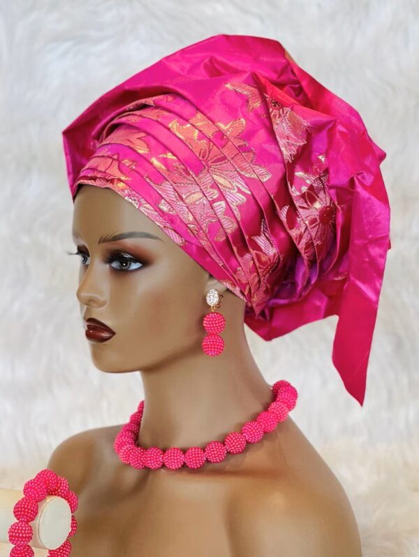 Pink headwrap with matching jewelry.