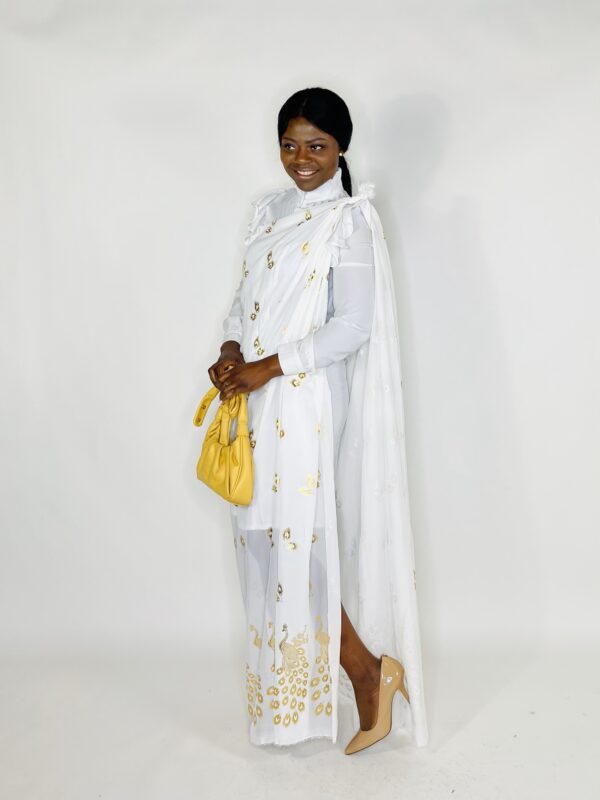 A woman in white dress holding onto a yellow purse