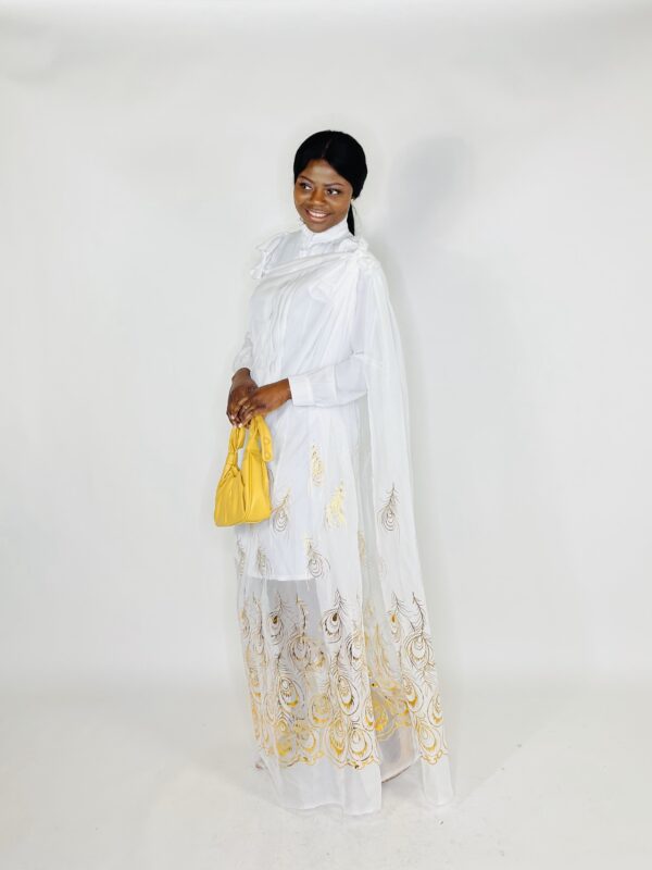 A woman in white dress holding a yellow purse.