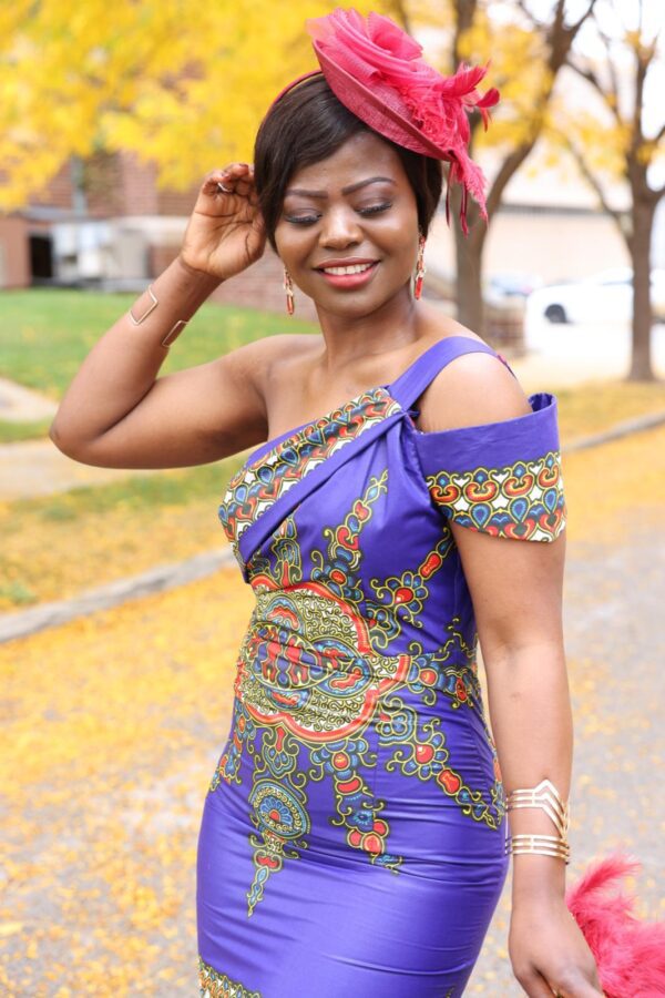 Woman in a purple patterned dress.