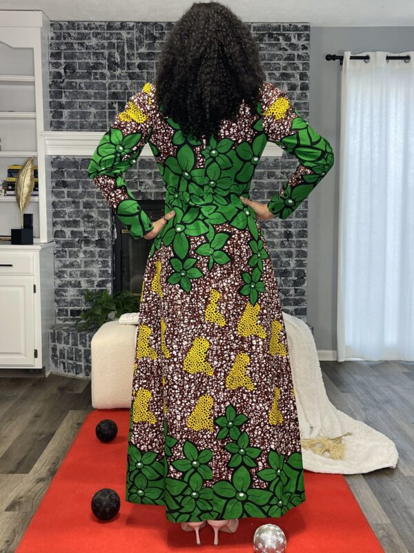 Woman in green and brown floral dress