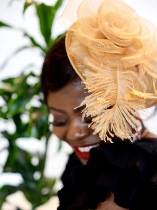 Woman wearing a feathered hat.