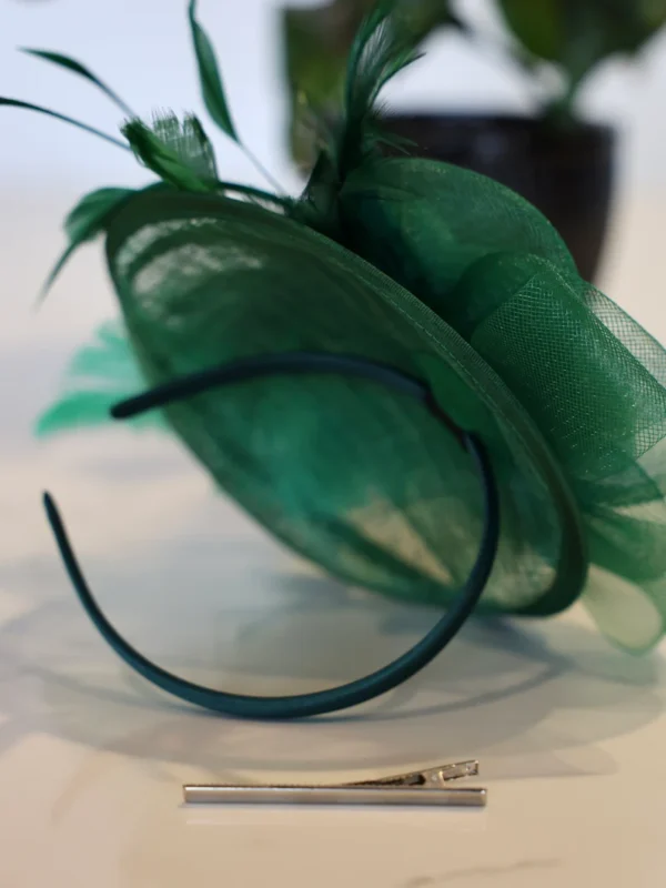 Green feathered headband with clip.