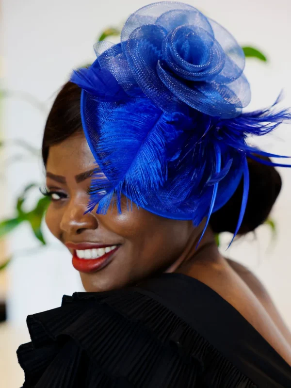 Woman wearing a blue feathered hat.