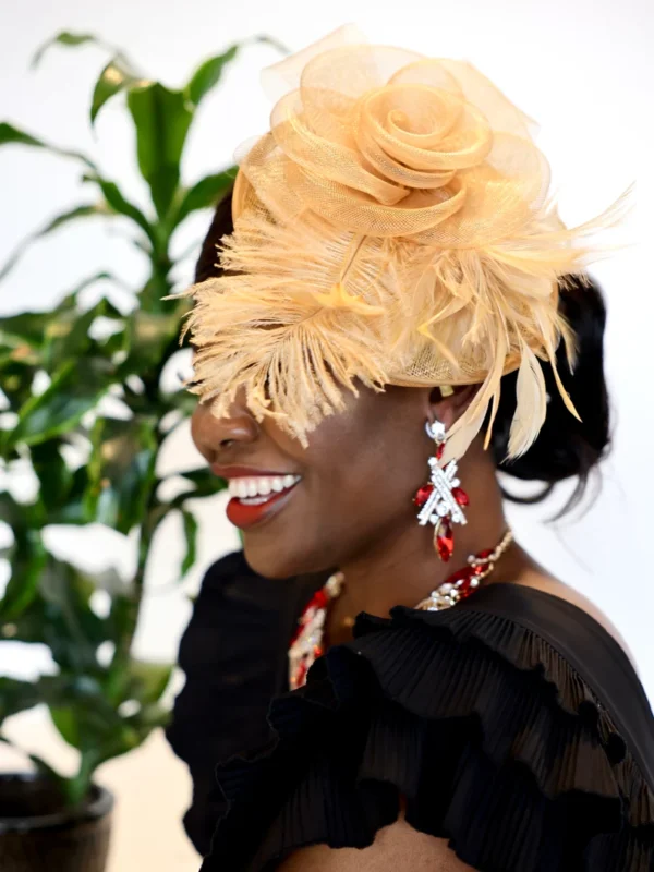 A woman wearing a black dress and feathers on her head.