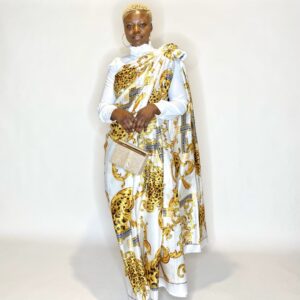 Woman in white and gold patterned saree.