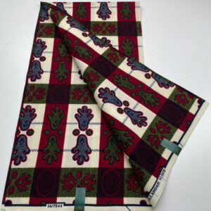 White fabric with red, blue, and green patterns.