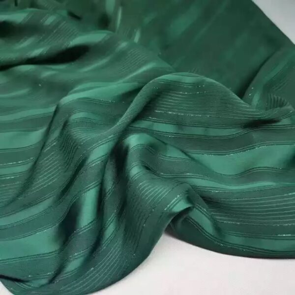 Green striped fabric with silver thread.