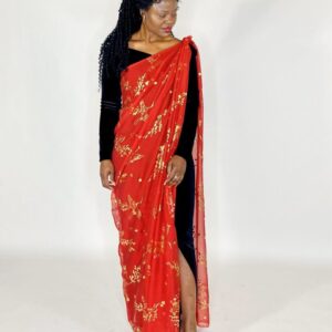 Woman wearing a red and gold sari.