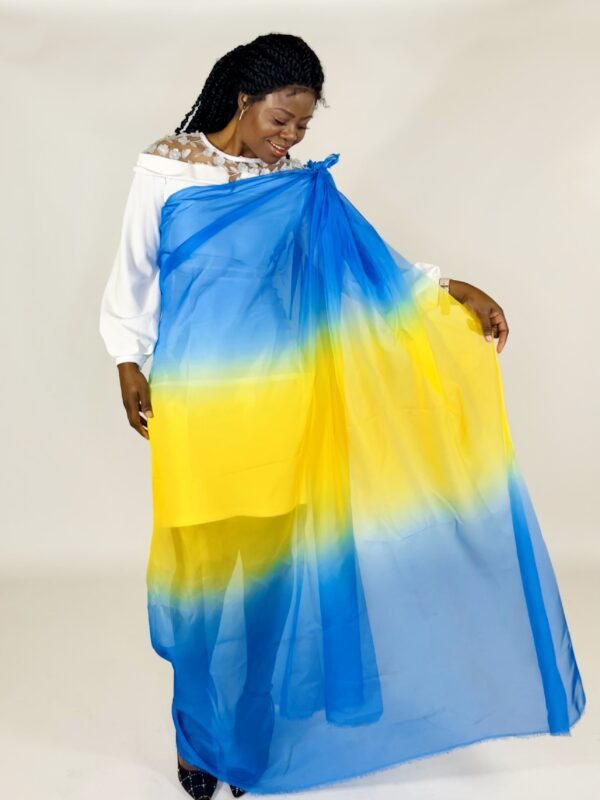 Woman in a blue and yellow ombre shawl.