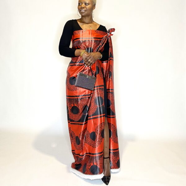 Woman in a red and black patterned dress.