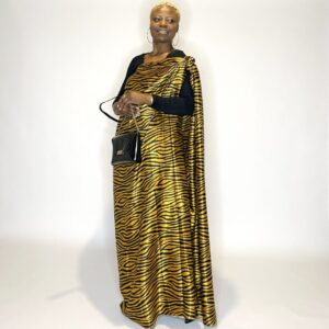 Woman in a gold and black zebra print dress.