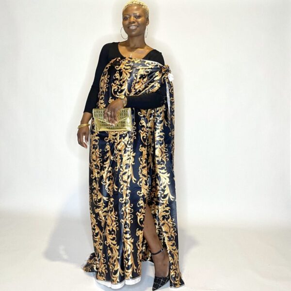 Woman in black and gold patterned dress.