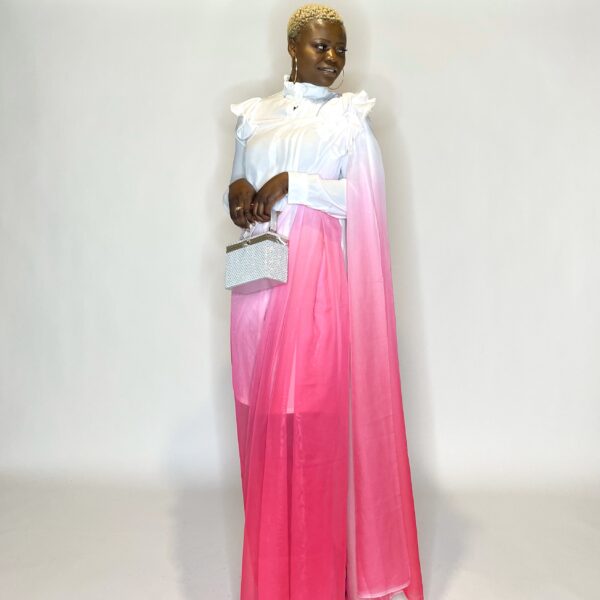 Woman in white shirt and pink ombre saree.