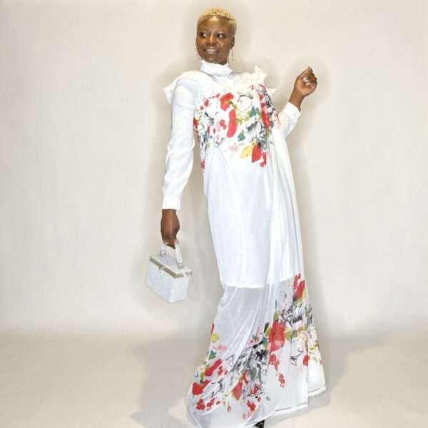 Woman in floral white dress and clutch.