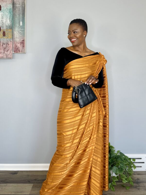 Woman in gold and black striped dress.