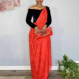 Woman wearing red and black saree dress.