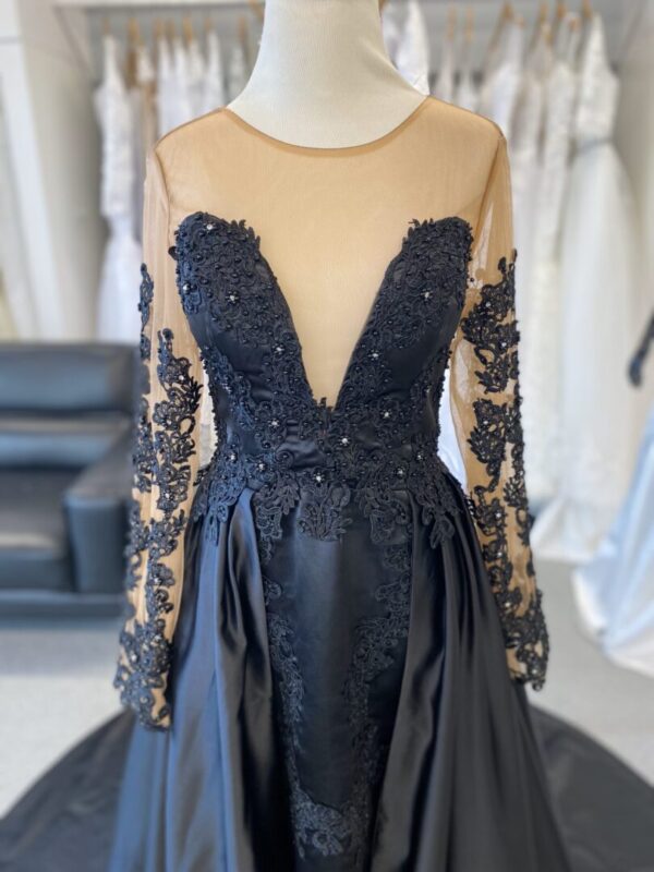 Black lace and satin long-sleeved gown.