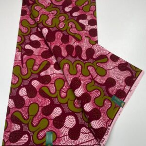 A close up of a fabric with green and red designs