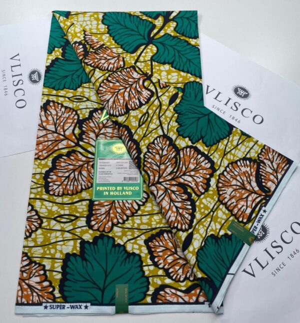 Green and orange leaf print fabric by Vlisco.