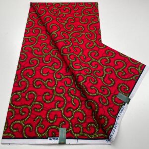 Red fabric with yellow swirl pattern.