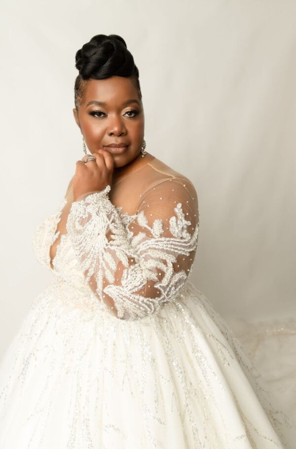 Bride in a beaded white wedding gown.